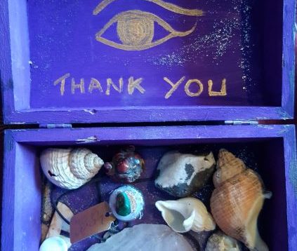 the psychic box with writing small